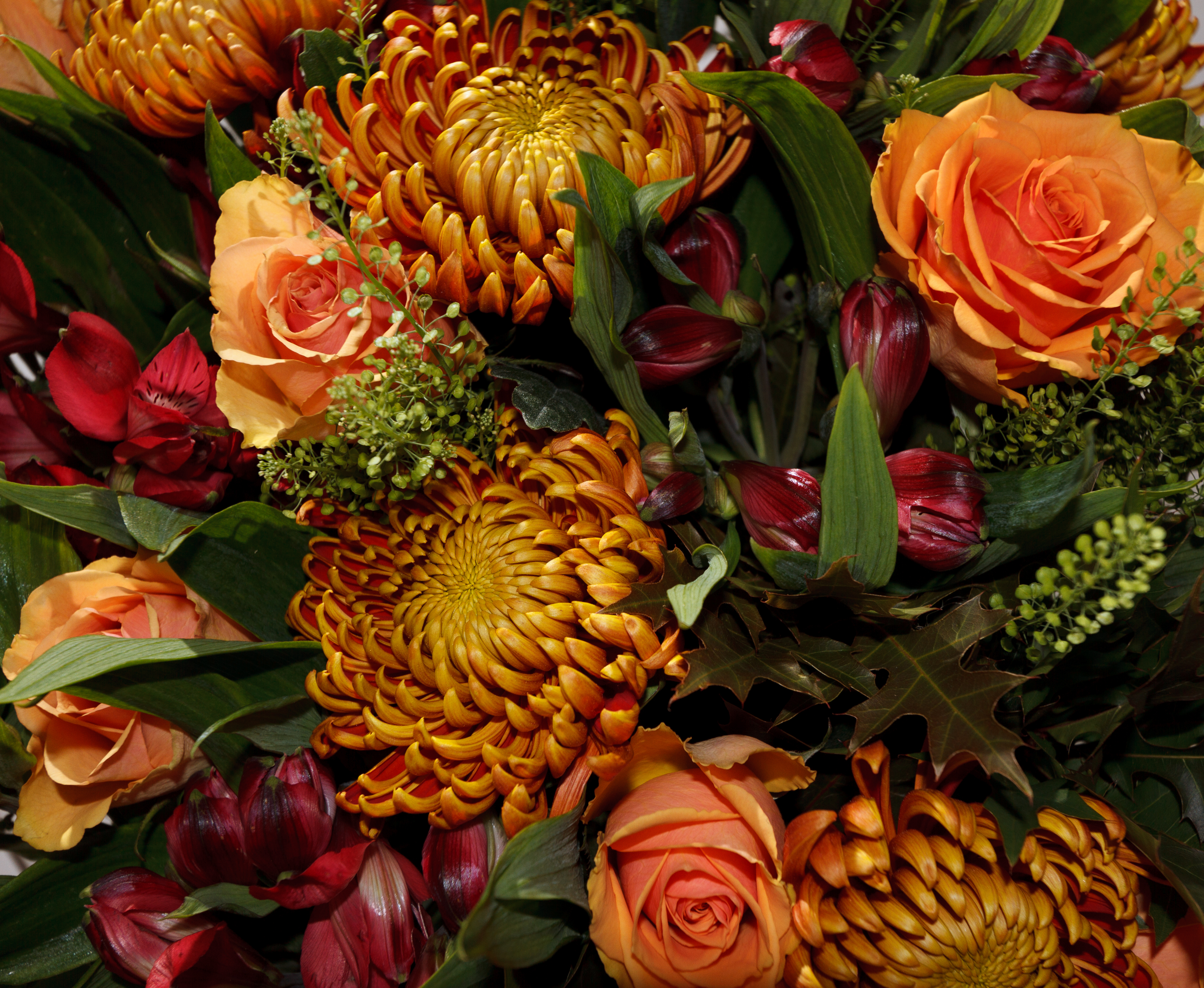 festive fall flower arrangement with orange flowers